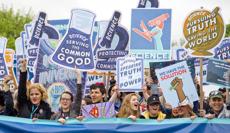 Group of people rallying for more science