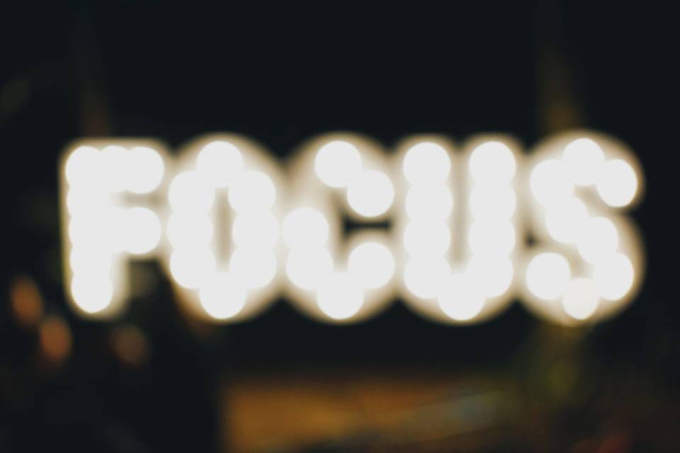 The word "Focus" in lights pictured out of focus