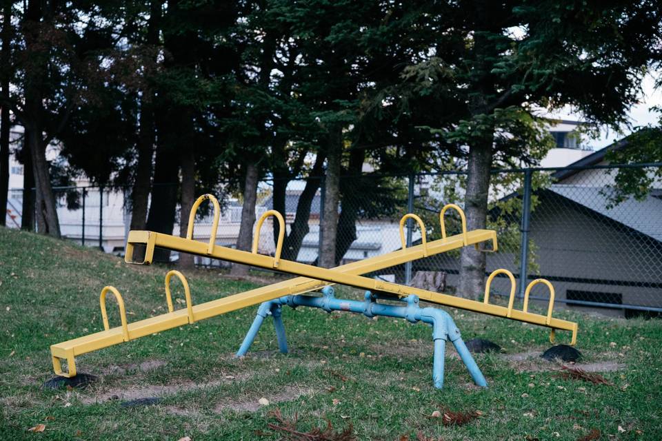yellow and blue steel seesaw (not an emotional one)