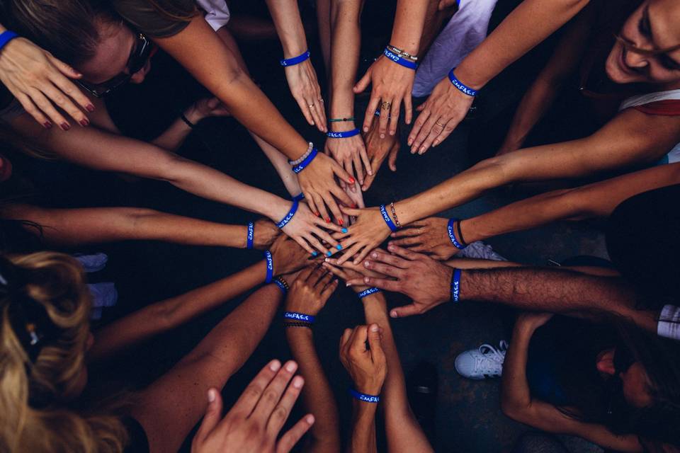 A lot of hands touching for a rally call